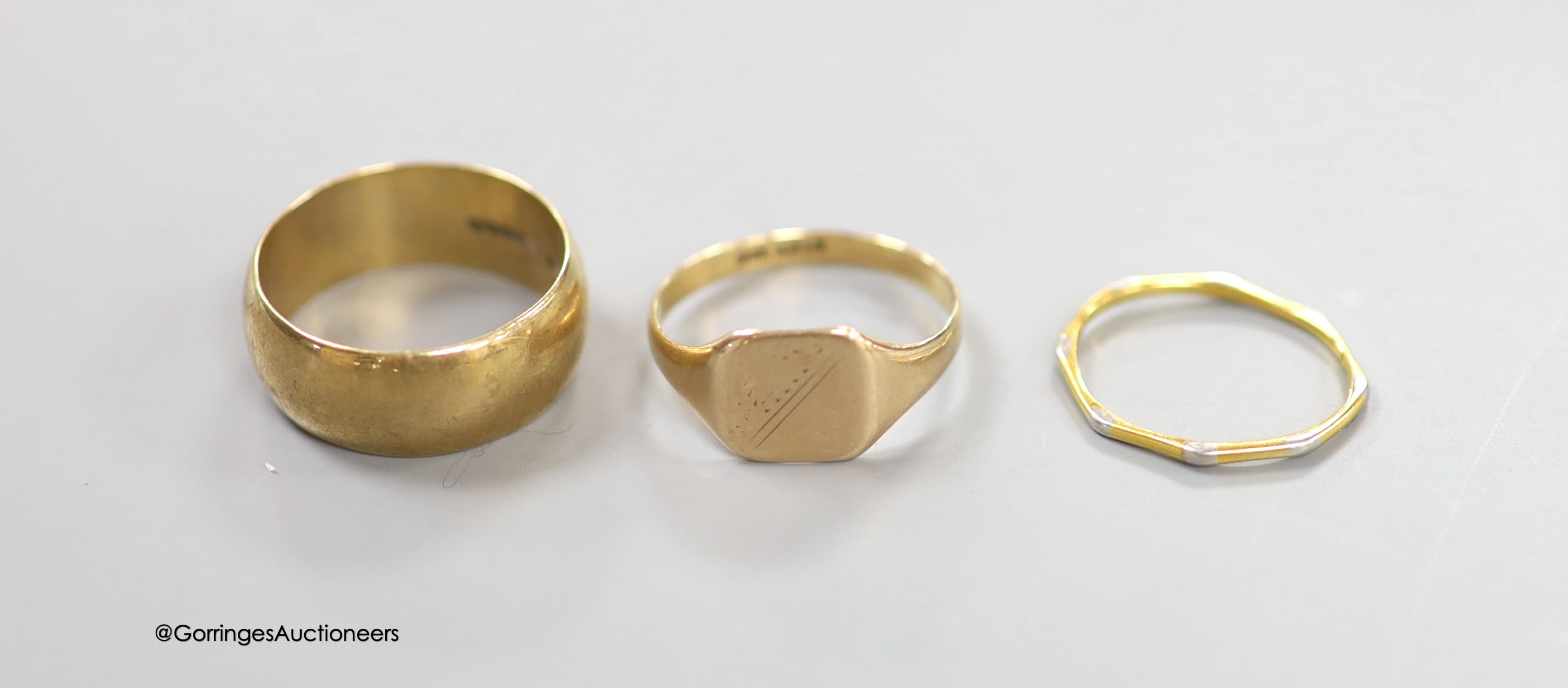 Two 9ct rings including a signet ring, 10 grams and one other two colour metal ring.